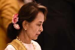 Myanmar's State Counsellor Aung San Suu Kyi attends the plenary session of the 34th Association of Southeast Asian Nations (ASEAN) Summit in Bangkok on June 22, 2019. (Photo by Lillian SUWANRUMPHA / AFP)