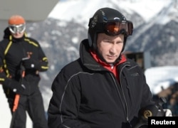 Russian President Vladimir Putin visits the "Laura" cross-country ski and biathlon center in the resort of Krasnaya Polyana near Sochi, Jan. 3, 2014.