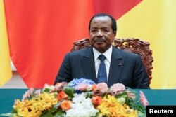 FILE - President of Cameroon Paul Biya attends a signing ceremony with Chinese President Xi Jinping (not pictured) at The Great Hall Of The People in Beijing, China, March 22, 2018.