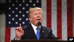 President Donald Trump delivers his first State of the Union address in the House chamber of the U.S. Capitol to a joint session of Congress, Jan. 30, 2018 in Washington.