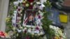 A portrait of Private Danny Chen is displayed on a funeral procession vehicle during the procession in New York, October 13, 2011.