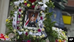 A portrait of Private Danny Chen is displayed on a funeral procession vehicle during the procession in New York, October 13, 2011.