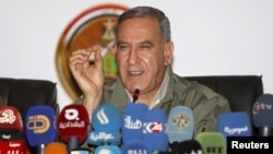FILE - Khalid al-Obeidi, now ousted as Iraq's defense minister, speaks during a news conference in Baghdad, Dec. 19 2015.