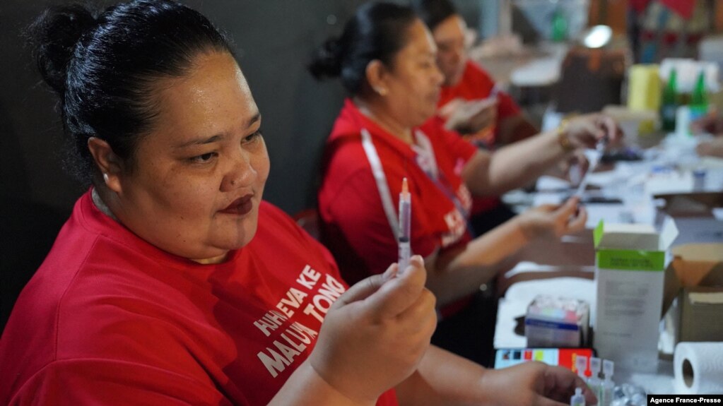 This photo was taken and released by Matangi Tonga on Oct. 30, 2021, shows a Tongan nurse preparing to vaccinate people against COVID-19 inside Queen Salote Memorial Hall in Nuku'alofa. (Photo by Eleanor Gee)