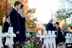 President Donald Trump's White House senior adviser Jared Kushner and Ivanka Trump, the daughter of President Donald Trump, second from left, stand at a memorial for those killed at the Tree of Life Synagogue in Pittsburgh, Oct. 30, 2018.
