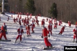 A ski resort in Maine welcomed 150 skiing and snowboarding Santas, Dec. 6, to raise money for charity.