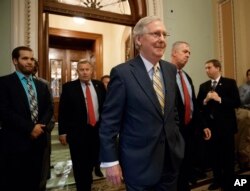 Senate Majority Leader Mitch McConnell of Kentucky leaves the Senate chamber on Capitol Hill in Washington, July 13, 2017, after announcing the revised version of the Republican health care bill.