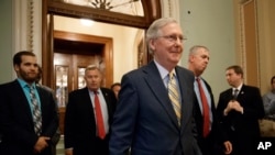 Senate Majority Leader Mitch McConnell of Kentucky leaves the Senate chamber on Capitol Hill in Washington, July 13, 2017, after announcing the revised version of the Republican health care bill.