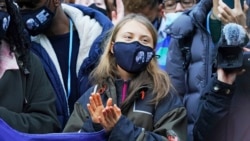 Swedish climate activist Greta Thunberg, centre, attends a 'Fridays For Future' climate protest on the fringes of the COP26 U.N. Climate Summit, in Glasgow, Scotland, Nov. 1, 2021.