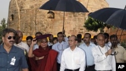 Burma President Thein Sein, center, visits Buddhist pilgrimage site Sarnath, 13 kilometers (8 miles) east of Varanasi, India, October 13, 2011.