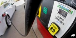 FILE - A motorist fills up with gasoline containing ethanol in Des Moines, Iowa, July 26, 2013. U.S. inventories of ethanol reached 920 million gallons in the week ended November 17, 2017, up 16 percent from a year earlier, the U.S. Energy Information Administration said.