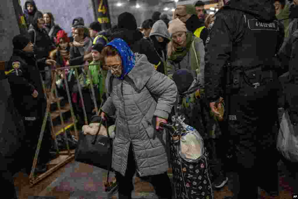 Displaced people queue to get on a train to Poland, inside Lviv railway station, in Lviv, western Ukraine, March 3, 2022.
