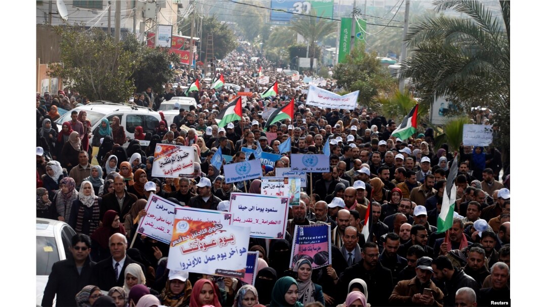 Employees of United Nations Relief and Works Agency (UNRWA) take part in a protest against a U.S. decision to cut aid, in Gaza City, Jan. 29, 2018.