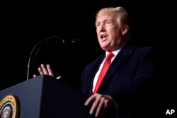 President Donald Trump speaks at a rally at Central Wisconsin Airport in Mosinee, Wis., Oct. 24, 2018.