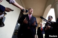 Defense attorney Timothy Parlatore, representing U.S. Navy SEAL Special Operations Chief Edward Gallagher, speaks with reporters at a pretrial hearing for Gallagher's court martial for alleged war crimes in Iraq, in San Diego, May 22, 2019.