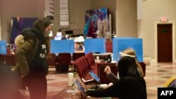 Voters arrive at the neighborhood church polling station in Candler Park on January 5, 2021 in Atlanta, Georgia during the Georgia runoffs elections