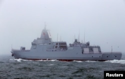 FILE - The Chinese navy's 055-class guided missile destroyer Nanchang takes part in a naval parade off the eastern port city of Qingdao, April 23, 2019.