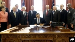 President Obama signs the Russia and Moldova Jackson-Vanik Repeal and Sergei Magnitsky Rule of Law Accountability Act Oval Office, Washington, Dec. 14, 2012.