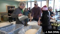 George Mason University students participate in Love Week, packaging 40,000 meals for refugees.