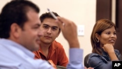 FILE - Christian Sanchez listened during an English Second Language class at the University of Texas-Southmost College campus, in Brownsville, Texas, Wednesday, Sept. 6, 2006. (AP Photo/Brad Doherty)