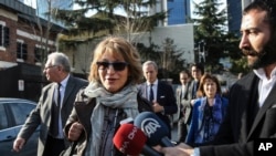 FILE - U.N. Special Rapporteur Agnes Callamard, surrounded by reporters, walks around the Saudi Consulate in Istanbul, Turkey, Jan. 29, 2019. 