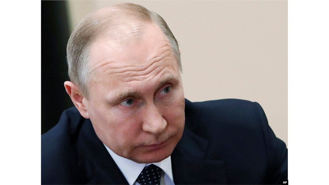 FILE - Russian President Vladimir Putin listens during a meeting in Moscow, Russia, Friday, April 13, 2018.