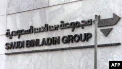 FILE - The logo of of the Saudi Binladin Group is seen at the company's headquarters in Jeddah, Saudi Arabia, Sept. 20, 2001.