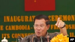 Cambodia's Prime Minister Hun Sen gestures as he delivers a speech during his presiding over an inauguration ceremony for the official use of a friendship bridge between Cambodia and China at Takhmau, Kandal provincial town south of Phnom Penh, file photo. 