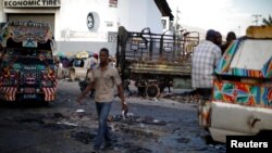  Yon ri nan pòtoprens Ayiti, 10 jiyè 2018. Foto: REUTERS/Andres Martinez Casares - 