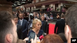 Writer J.K. Rowling talks to media upon arrival at the gala performance of Harry Potter and the Cursed Child, at the Palace Theatre in central London, Saturday, July 30, 2016.