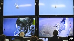 In this photo provided by Red Bull, pilot Felix Baumgartner of Austria is seen in a screen at mission control center in the capsule during the final manned flight for Red Bull Stratos in Roswell, N.M. on Sunday, Oct. 14, 2012.