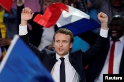 FILE - Emmanuel Macron, then-candidate for the 2017 presidential election, attends a campaign rally in Albi, France, May 4, 2017.