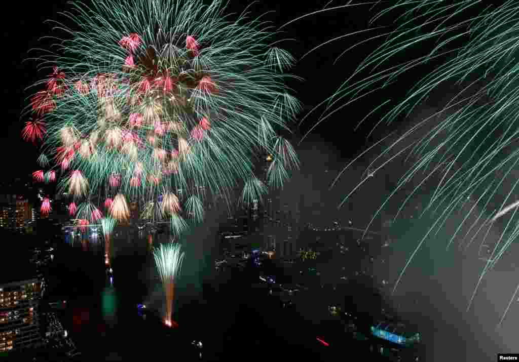 Fireworks explode over the Chao Phraya River during the New Year celebrations, amid the spread of the COVID-19 in Bangkok, Thailand, Jan. 1, 2022.