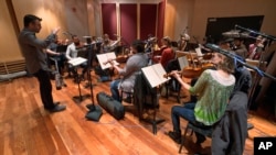 The Contemporary Directions Ensemble under the direction of Professor Oriol Sans in Ann Arbor recording "The Most Beautiful Time of Life." (Christopher Boyes/University of Michigan via AP)