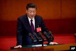 FILE - Chinese President Xi Jinping delivers a speech during the opening session of China's 19th Party Congress at the Great Hall of the People in Beijing, Oct. 18, 2017.