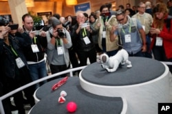 The Aibo robot dog is on display at the Sony booth after a news conference at CES International, Monday, Jan. 8, 2018, in Las Vegas. (AP Photo/John Locher)