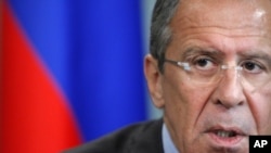 Russian Foreign Minister Sergei Lavrov, answers questions during Moscow news conference, June 28, 2012