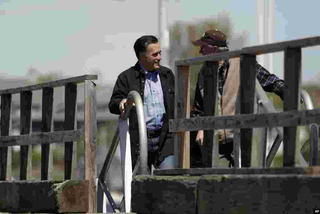 Republican presidential candidate, former Massachusetts Gov. Mitt Romney talks to Erik Anderson during his visit to the Portsmouth Fish Pier in Portsmouth, New Hampshire, April 30, 2012. (AP)