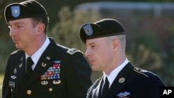 FILE - Army Sgt. Bowe Bergdahl, right, arrives for a pretrial hearing at Fort Bragg, N.C., with his defense counsel Lt. Col. Franklin D. Rosenblatt.
