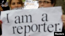 People take part in a flashmob to mark World Press Freedom Day in Tbilisi, Georgia, May 3, 2012.