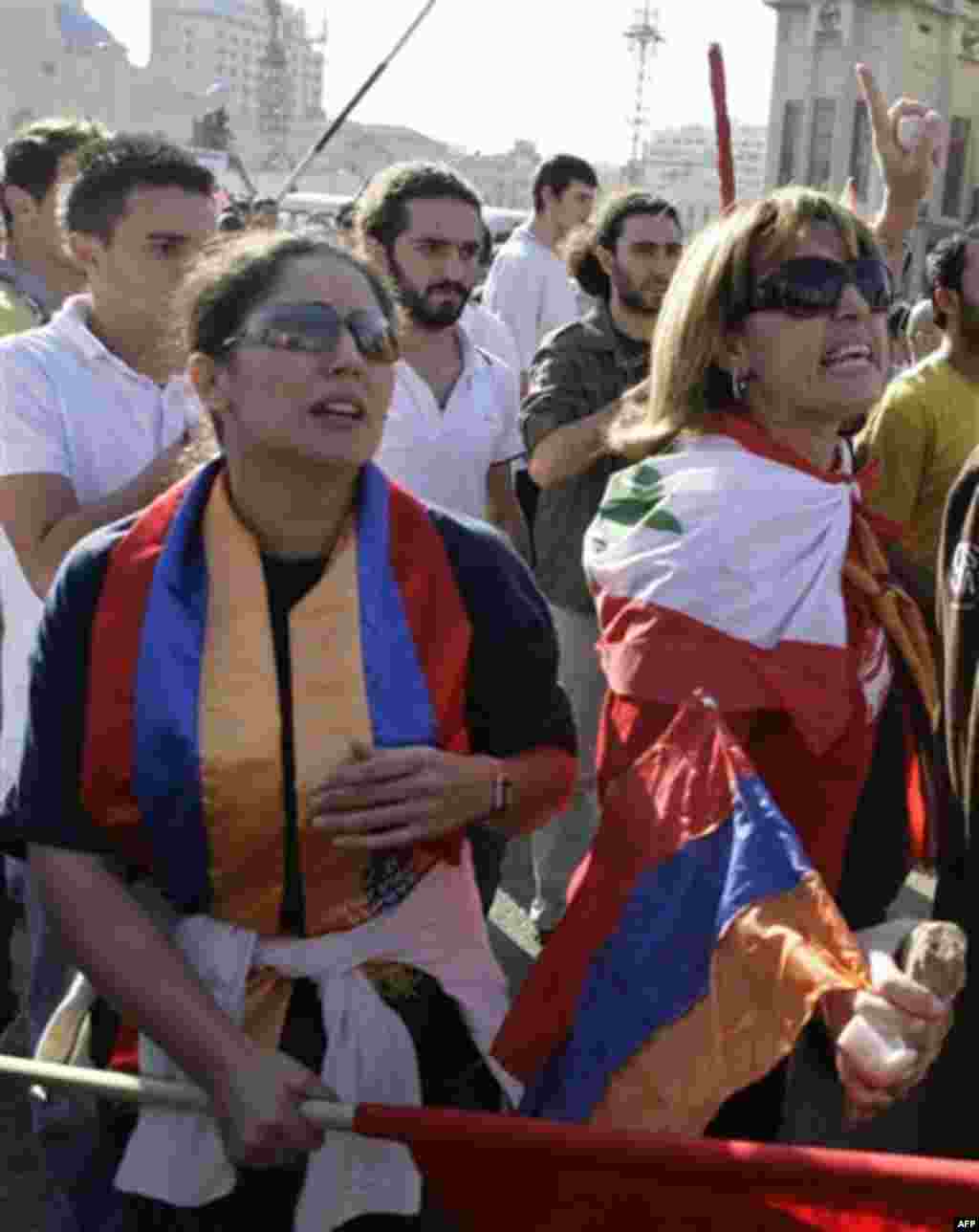 Lebanese women of Armenian descent react during a protest against the visit of Turkish Prime Minister Recep Tayyip Erdogan in Beirut's Martyrs' Square, Lebanon, Thursday, Nov. 25, 2010. Armenians accuse Turkey of mass ethnic killings early last century. (