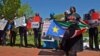 South Sudanese protest outside the White House in Washington, D.C. on Tuesday, Apr. 28, 2015. The protesters want President Salva Kiir to step down and say more targeted sanctions are needed against those blocking peace in South Sudan.