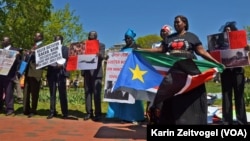 South Sudanese protest outside the White House in Washington, D.C. on Tuesday, Apr. 28, 2015. The protesters want President Salva Kiir to step down and say more targeted sanctions are needed against those blocking peace in South Sudan.