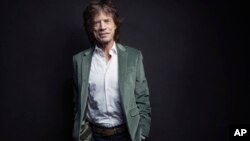 FILE - Mick Jagger of the Rolling Stones poses for a portrait in New York, Nov. 14, 2016. 