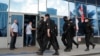 FILE - Belarusian law enforcement officers enter the building of the Belarusian National State TV and Radio Company, in Minsk, Belarus, Aug. 15, 2020. 