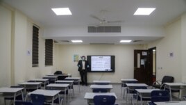 A teacher records an online class at school, following the outbreak of the coronavirus disease (COVID-19) in the holy city of Karbala, Iraq March 26, 2020. (REUTERS/Abdullah Dhiaa Al-Deen)