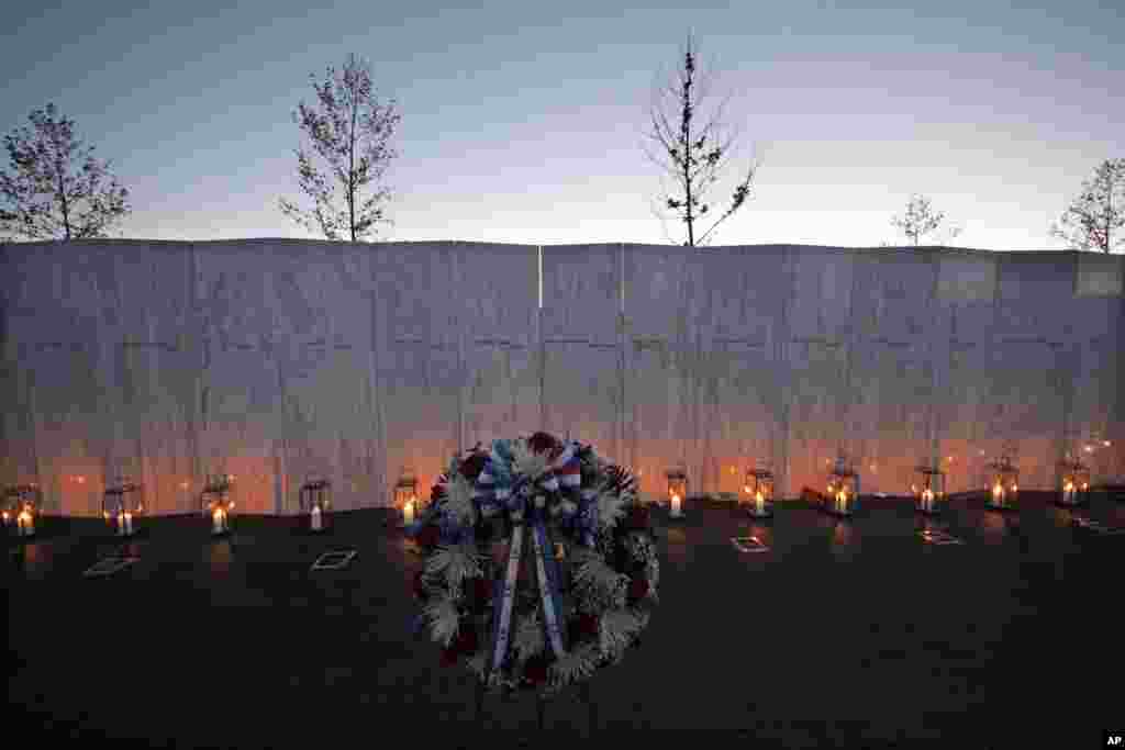 Forty luminaria are placed at the wall of names in memory of the 40 passengers and crew of United Flight 93 at the Flight 93 National Memorial at sunset on September 10, 2012 in Shanksville, Pennsylvania.