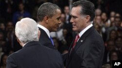 President Barack Obama and Republican presidential nominee Mitt Romney greet one another as moderator Bob Schieffer watches at the start of the third presidential debate at Lynn University, October 22, 2012.