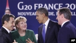 President Barack Obama speaks with, from left, French President Nicolas Sarkozy, German Chancellor Angela Merkel, and British Prime Minister David Cameron; during a working lunch at the G20 Summit in Cannes, France, Thursday, Nov. 3, 2011.