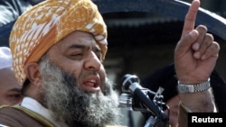 Maulana Fazlur Rehman, leader of the Jamiat-e-Ulema Islam party, speaks during an anti-U.S. demonstration in Peshawar, Oct. 6, 2001.